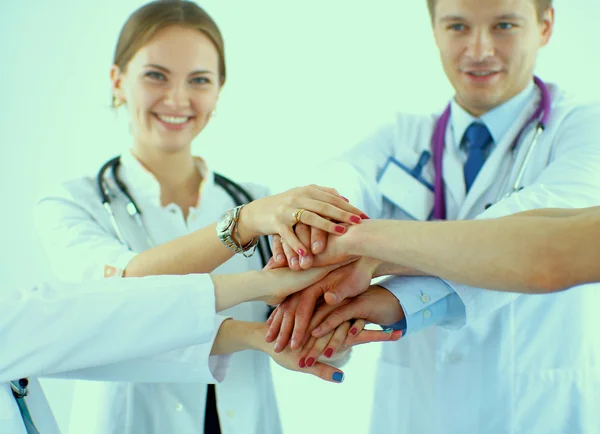 Doctors and nurses in a medical team stacking hands — Stock Photo, Image