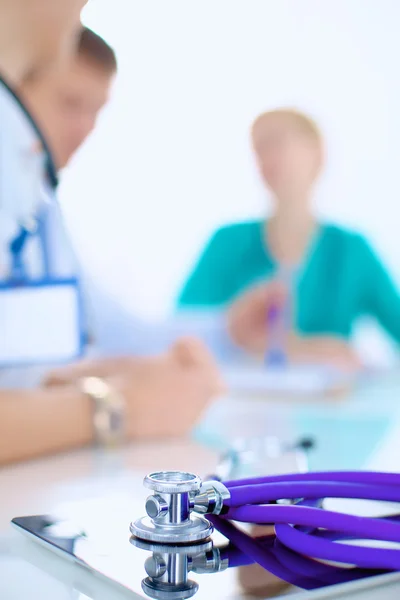 Young female doctor sitting at the desk — Stock Photo, Image