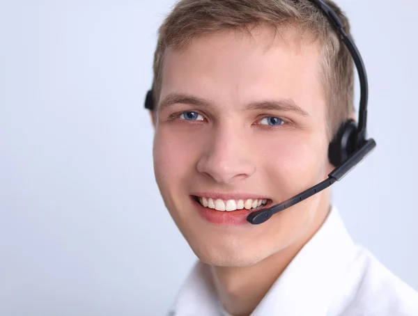 Operador de suporte ao cliente com fone de ouvido em fundo branco — Fotografia de Stock