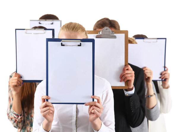 Team of businesspeople holding a folders near face isolated on white background