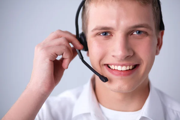 Operador de atención al cliente con auriculares sobre fondo blanco —  Fotos de Stock