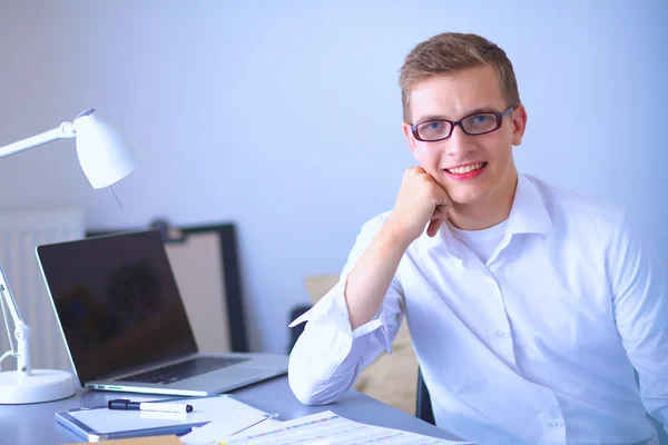 Young businessman working in office, sitting near desk — Stock Photo, Image