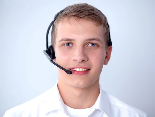 Kundsupport operatören med ett headset på vit bakgrund — Stockfoto