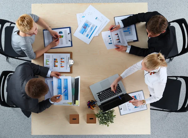 Business people sitting and discussing at business meeting, in office — Stock Photo, Image