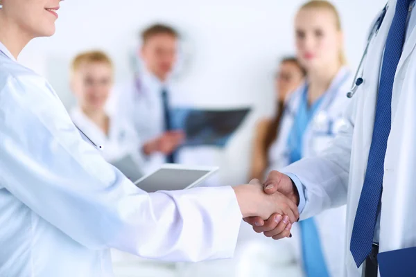 Young medical people handshaking at office — Stock Photo, Image