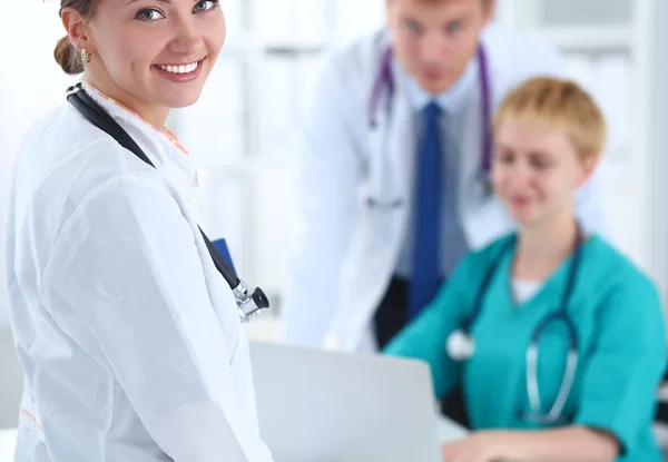Woman doctor standing with stethoscope at hospital Royalty Free Stock Images