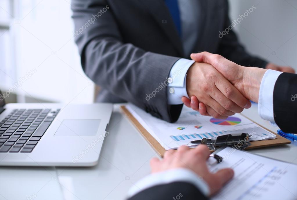 Business people shaking hands, finishing up a meeting