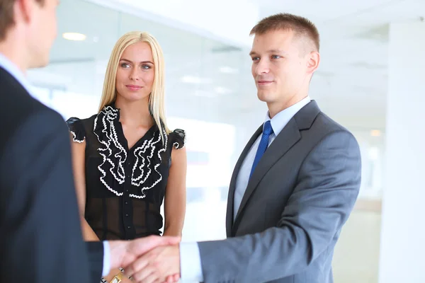 Businesswoman Shaking Hands In Office — Stock Photo, Image