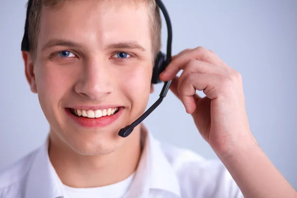 Operador de atención al cliente con auriculares sobre fondo blanco —  Fotos de Stock