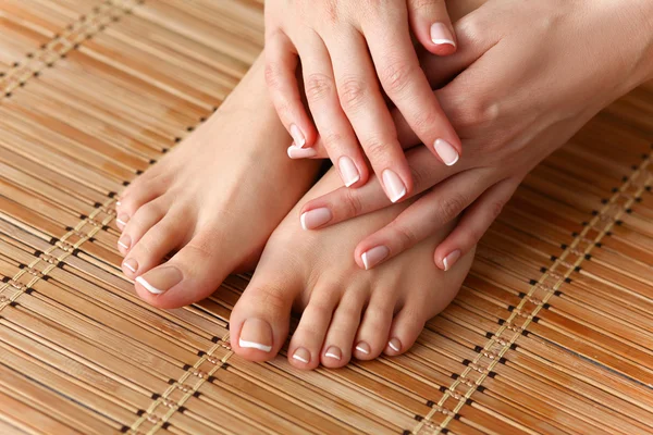 Care for beautiful woman legs on the floor — Stock Photo, Image