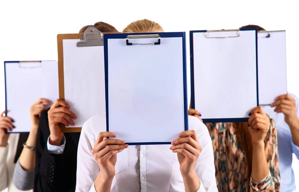 Team of businesspeople holding a folders near face isolated on white background — Stock Photo, Image