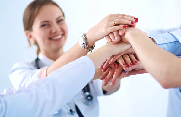 Doctors and nurses in a medical team stacking hands — Stock Photo, Image