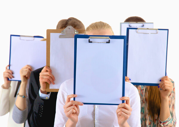 Team of businesspeople holding a folders near face isolated on white background