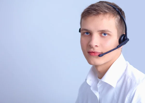 Operador de suporte ao cliente com fone de ouvido em fundo branco — Fotografia de Stock