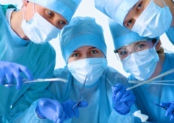 Below view of surgeons holding medical instruments in hands — Stock Photo, Image