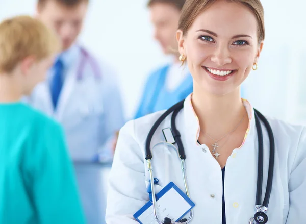 Woman doctor standing with stethoscope at hospital — Stock Photo, Image