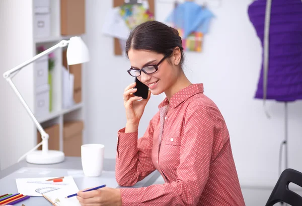 Clothes designer talking on the phone — Stock Photo, Image