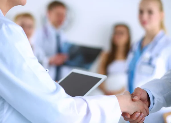 Young medical people handshaking at office — Stock Photo, Image