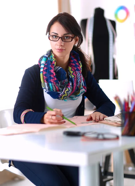 Dressmaker designing clothes pattern on paper — Stock Photo, Image