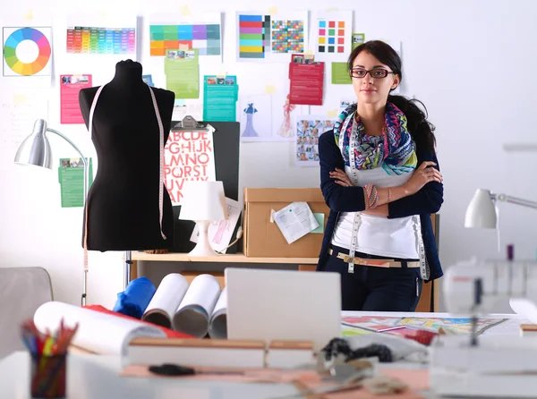 Beautiful fashion designer standing in studio — Stock Photo, Image