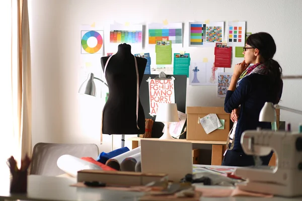 Beautiful fashion designer standing in studio — Stock Photo, Image