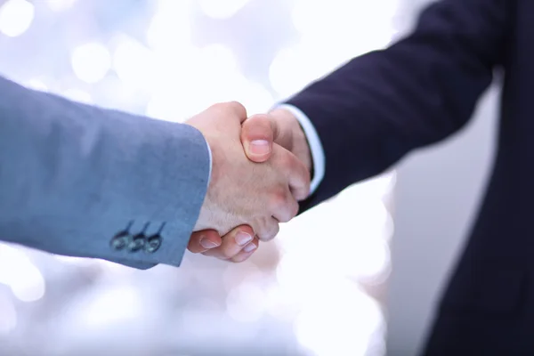 Businessmen shaking hands, isolated on white. — Stock Photo, Image