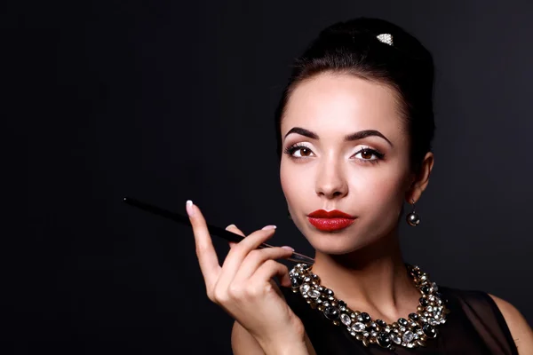 Retro woman portrait, standing on the black background — Stock Photo, Image