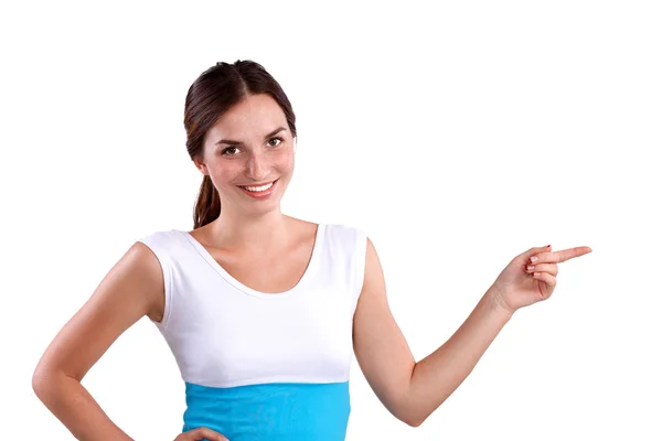 Portrait of a smiling young woman pointing up — Stock Photo, Image