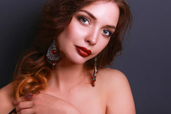 Portrait of young beautiful woman with jewelry — Stock Photo, Image