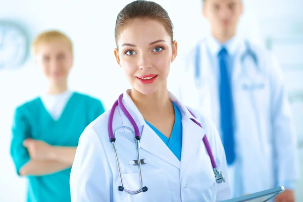 Woman doctor standing with stethoscope at hospital — Stock Photo, Image