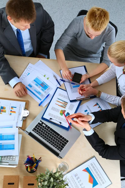 Business people sitting and discussing at business meeting, in office — Stock Photo, Image