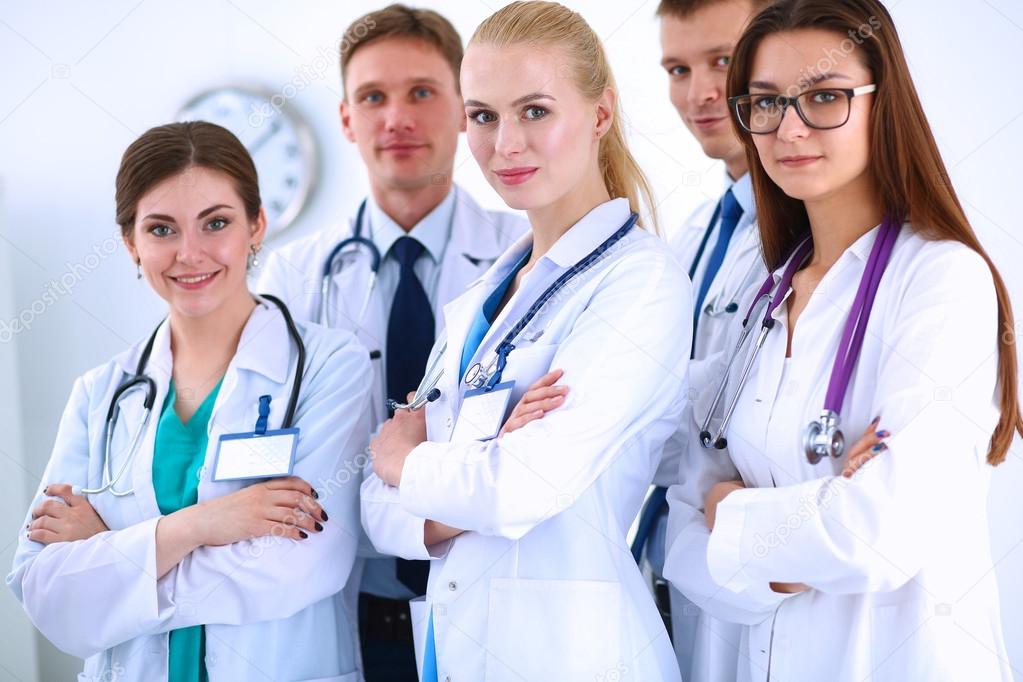 Portrait of group of smiling hospital colleagues standing together