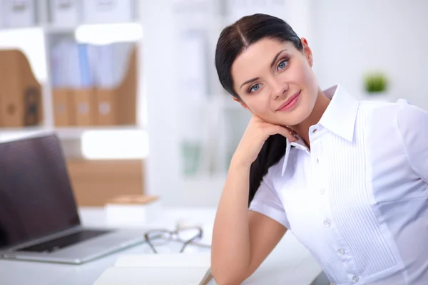 Attractive businesswoman sitting  in the office — Stock Photo, Image