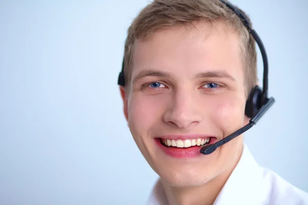 Kundsupport operatören med ett headset på vit bakgrund — Stockfoto