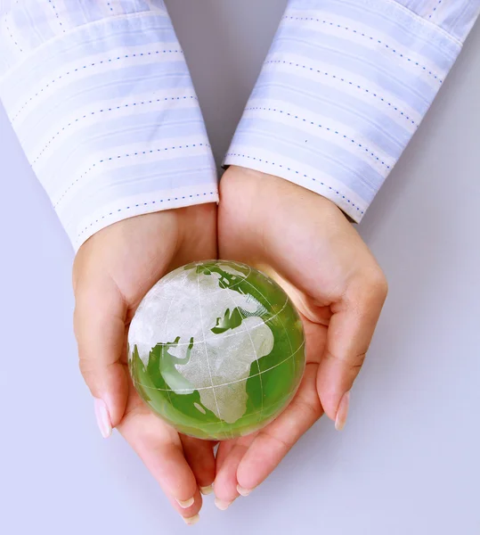 Hands holding a green earth, isolated on white background — Stock Photo, Image