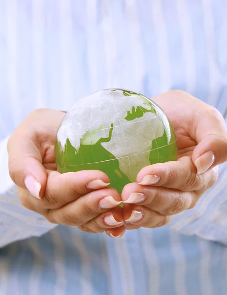 Hands holding a green earth, isolated on white background — Stock Photo, Image