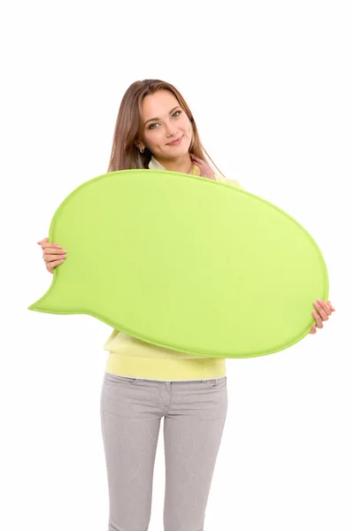 Portrait of a casual young woman holding blank card - over white background. — Stock Photo, Image