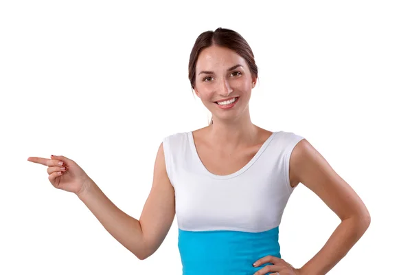 Portrait of a smiling young woman pointing up — Stock Photo, Image