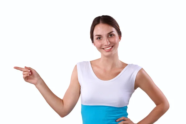 Retrato de una joven sonriente señalando hacia arriba — Foto de Stock