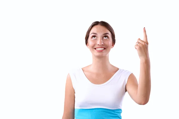 Retrato de una joven sonriente señalando hacia arriba — Foto de Stock