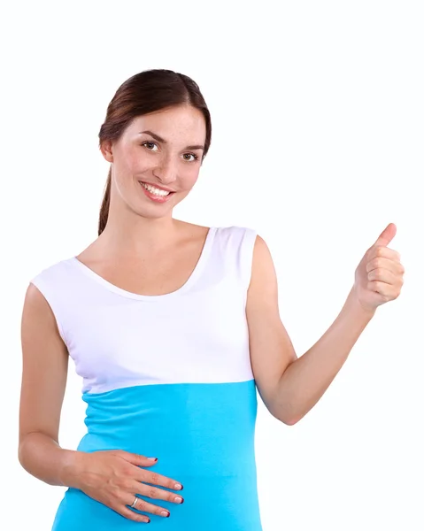 Portrait of a smiling young woman pointing up — Stock Photo, Image