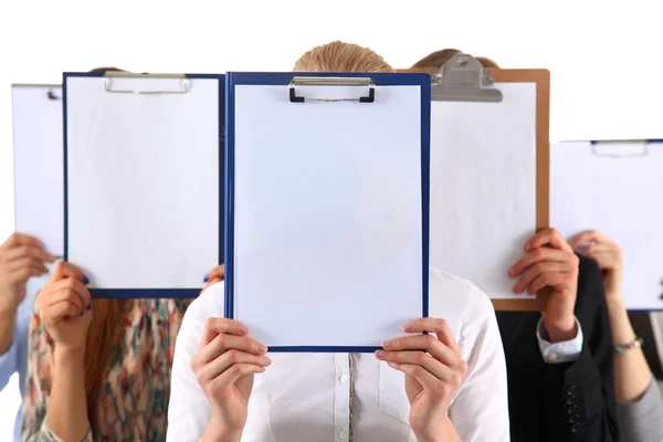 Team of businesspeople holding a folders near face isolated on white background — Stock Photo, Image