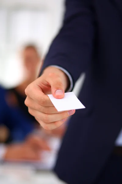 Closeup of a business man standing with card — Stock Photo, Image