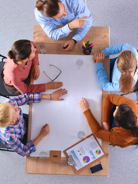 Business people sitting and discussing at business meeting, in office — Stock Photo, Image