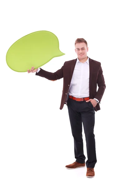 Homem segurando branco bolha de fala em branco com espaço para texto — Fotografia de Stock