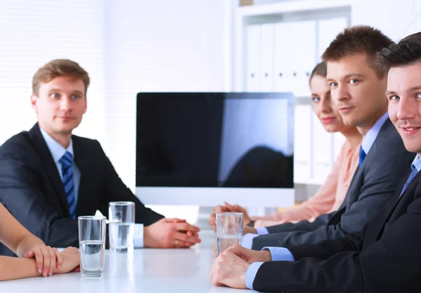 Business people sitting and discussing at business meeting, in office — Stock Photo, Image