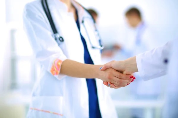 Young medical people handshaking at office — Stock Photo, Image