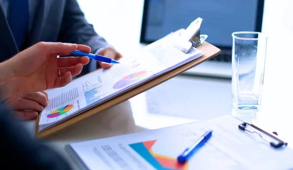 Businesspeople sitting on the desk on office — Stock Photo, Image