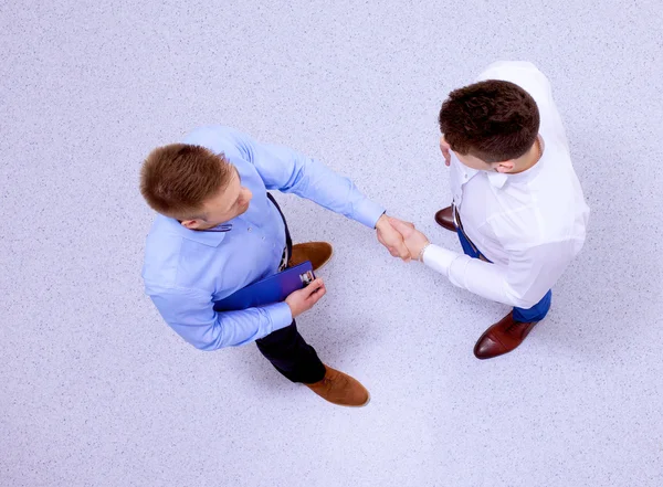 Empresários apertando as mãos - topview — Fotografia de Stock