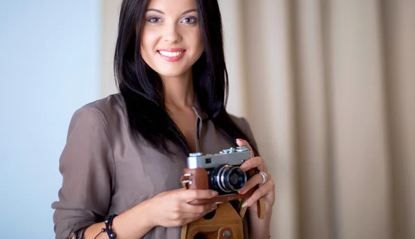 Young woman photographer processing pictures sitting on the desk — Stock Photo, Image